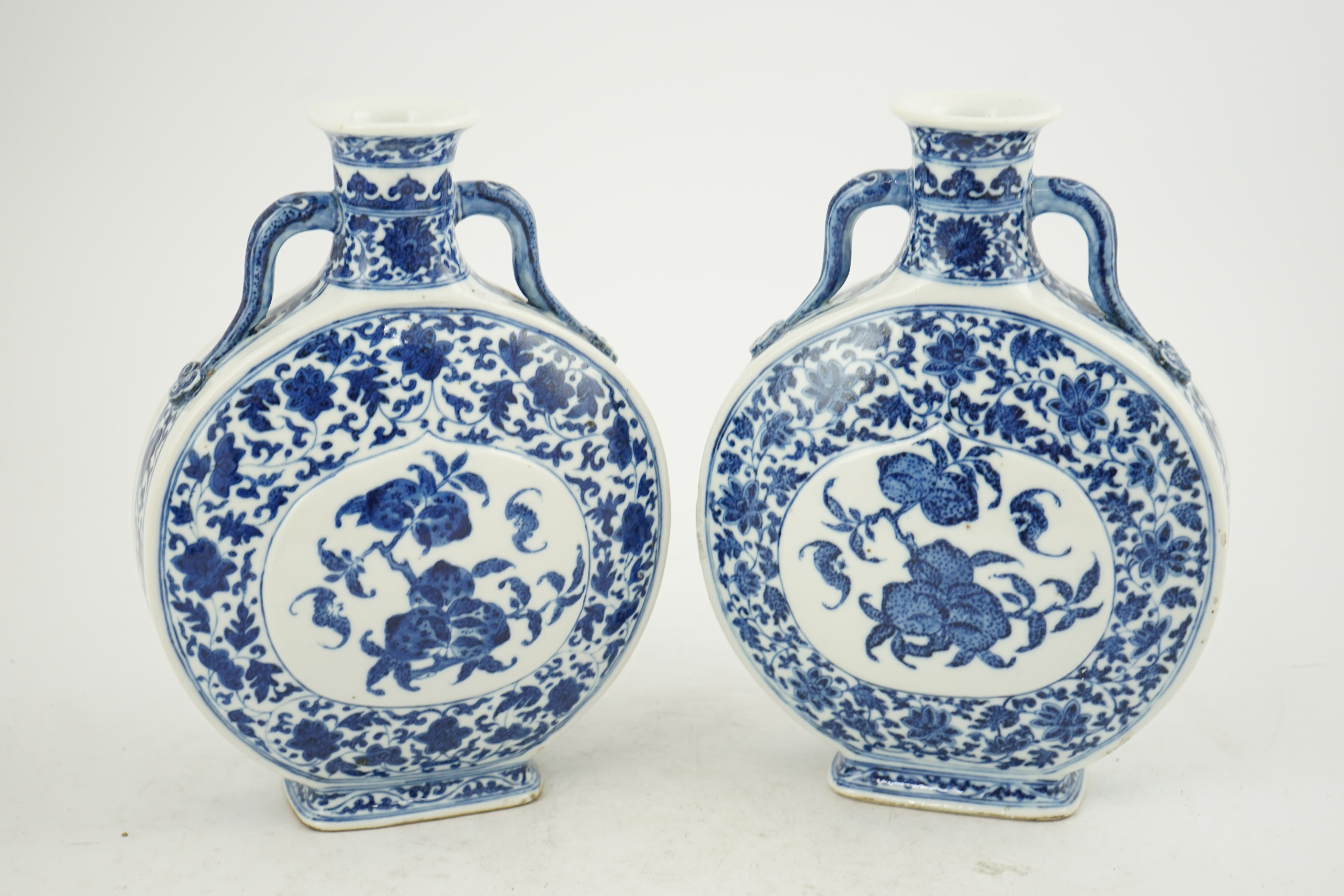 A near pair of Chinese blue and white moonflasks, bianhu, Daoguang seal marks and of the period (1821-50)